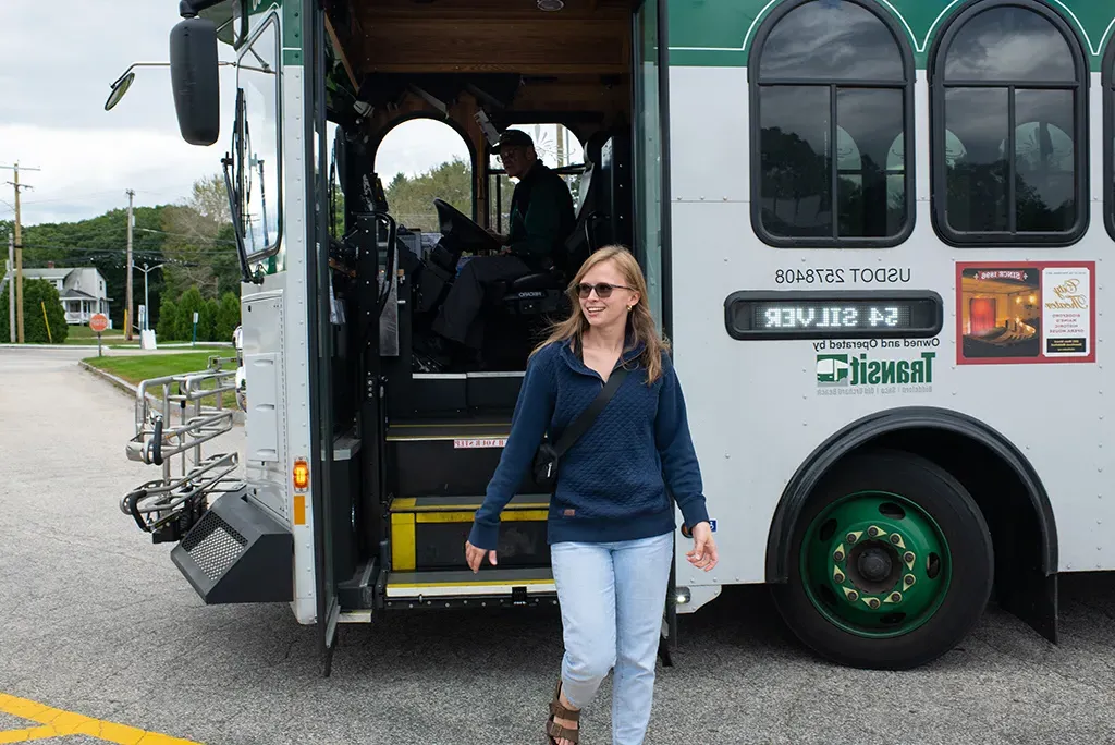 A student getting off the Biddeford bus